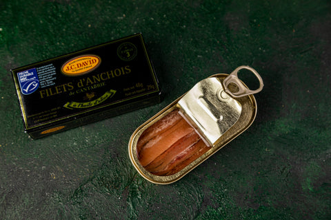 Canned Kantabryjskie anchois by JC David, 50g, with shiny silver fillets visible in the open can.